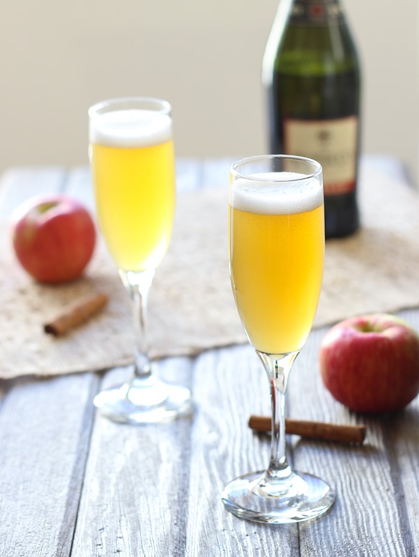 Spiced Apple Cider Spritzers- apple cider is simmered with cinnamon, clove, and ginger then served chilled with bubbly champagne. Easy to make and perfect for entertaining! 