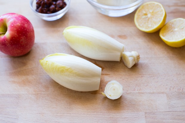 Endive leaves filled with crisp apples, creamy goat cheese, and crunchy smoked almonds make for an easy and delicious appetizer that everyone will love!