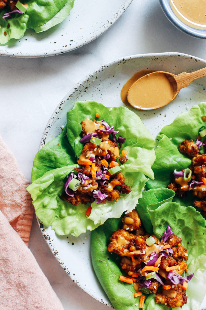 Peanut Sauce Tempeh Lettuce Wraps- crumbled tempeh is sautéed in savory peanut sauce and served in crisp lettuce wraps for a light and refreshing plant-based meal! (vegan, gluten-free, grain-free, low carb)