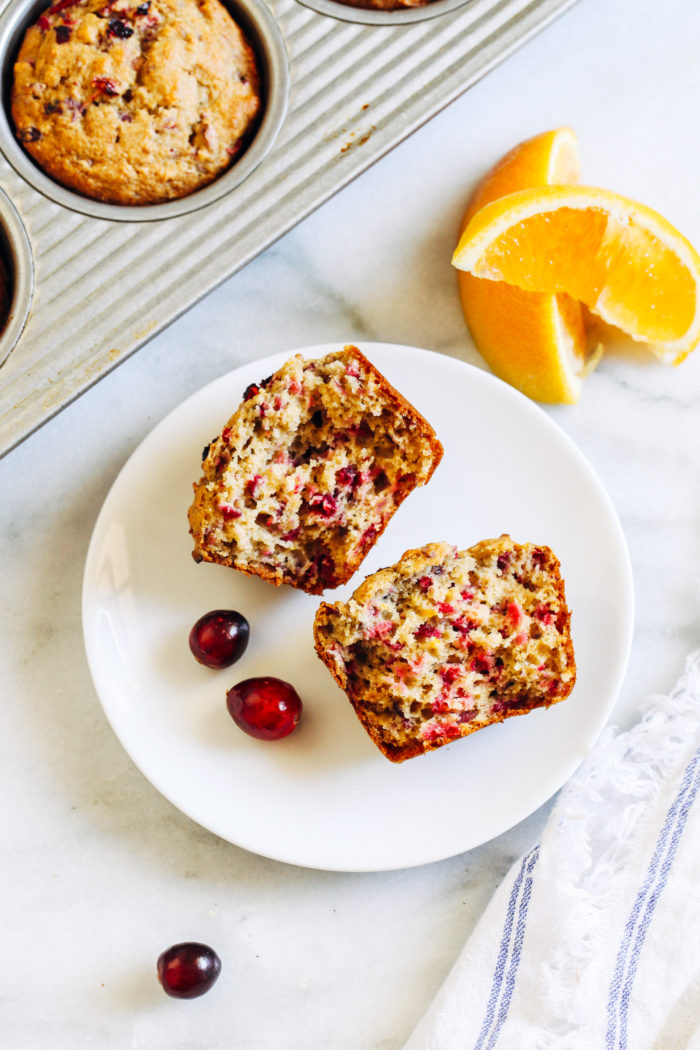 Gluten-free Cranberry Orange Muffins- made with a combination of wholesome gluten-free flours, these naturally sweetened muffins are bursting with flavor from fresh cranberries and orange zest. (vegan option)