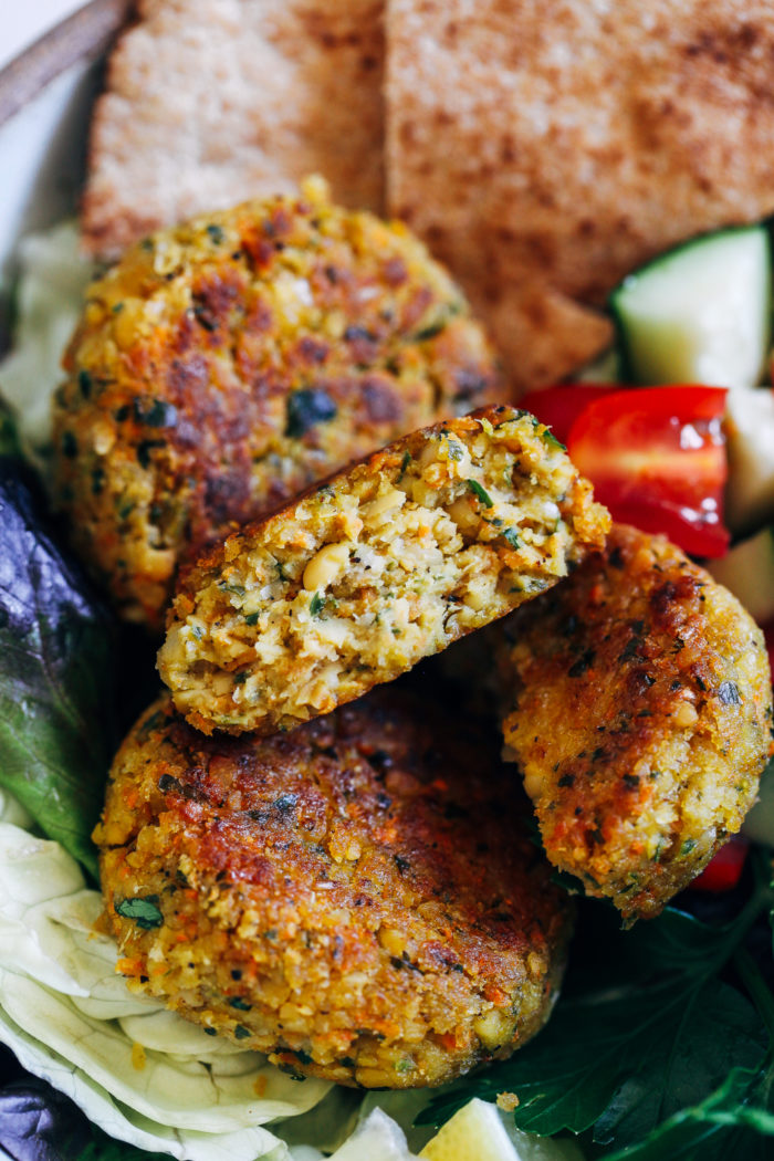 Gluten-free Vegan Falafel- simple to make and served with a delicious lemon yogurt sauce, these falafel are perfect to prep for lunches or dinner. #plantbased #cleaneating