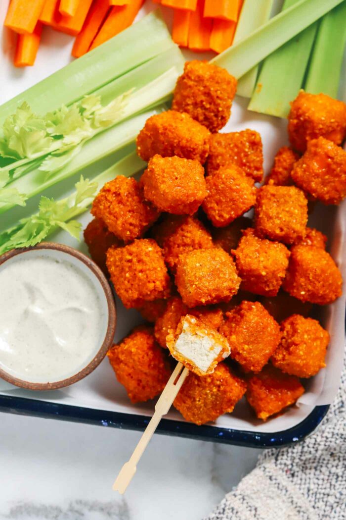 Baked Buffalo Tofu Bites- high in protein and bursting with flavor, these buffalo tofu bites are the perfect healthy snack. All you need is 9-ingredients to make them! (vegan + gluten-free option)