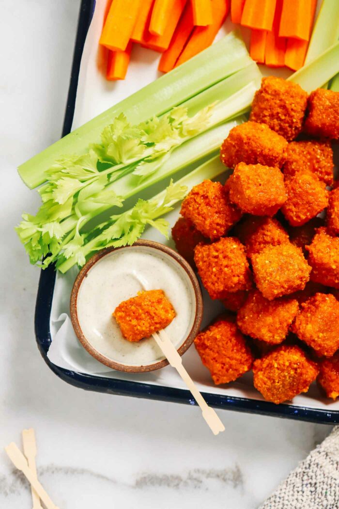 Baked Buffalo Tofu Bites- high in protein and bursting with flavor, these buffalo tofu bites are the perfect healthy snack. All you need is 9-ingredients to make them! (vegan + gluten-free option)