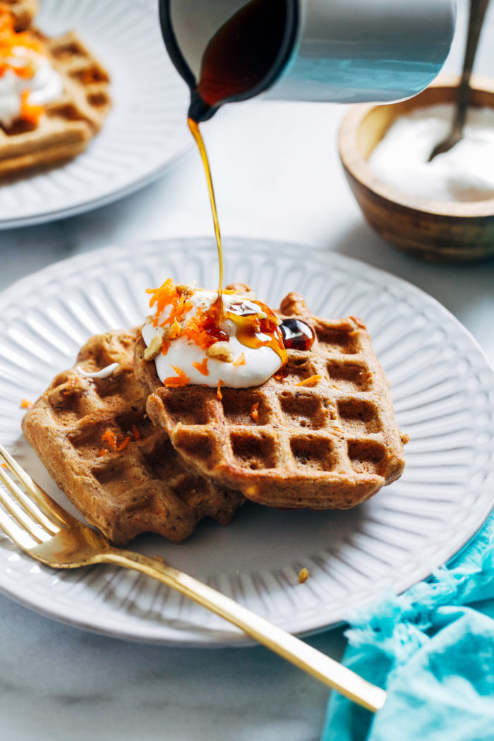 Carrot Cake Waffles- made with a blend of wholesome buckwheat and quinoa flours, these vegan waffles are packed full of satisfying protein and fiber. (plant-based + gluten-free)