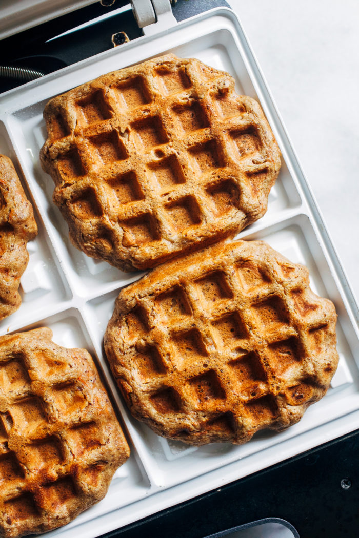 Carrot Cake Waffles- made with a blend of wholesome buckwheat and quinoa flours, these vegan waffles are packed full of satisfying protein and fiber. (plant-based + gluten-free)