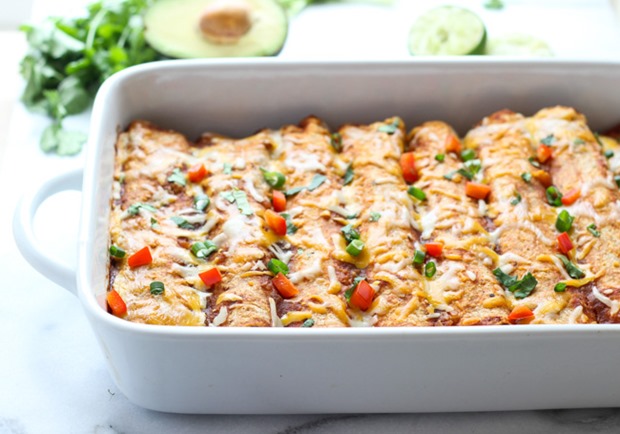 Sweet Potato Black Bean and Spinach Enchiladas- packed full of healthy veggies, these enchiladas are loaded with vitamins, mineral, protein and plenty of flavor! (vegetarian + gluten-free)