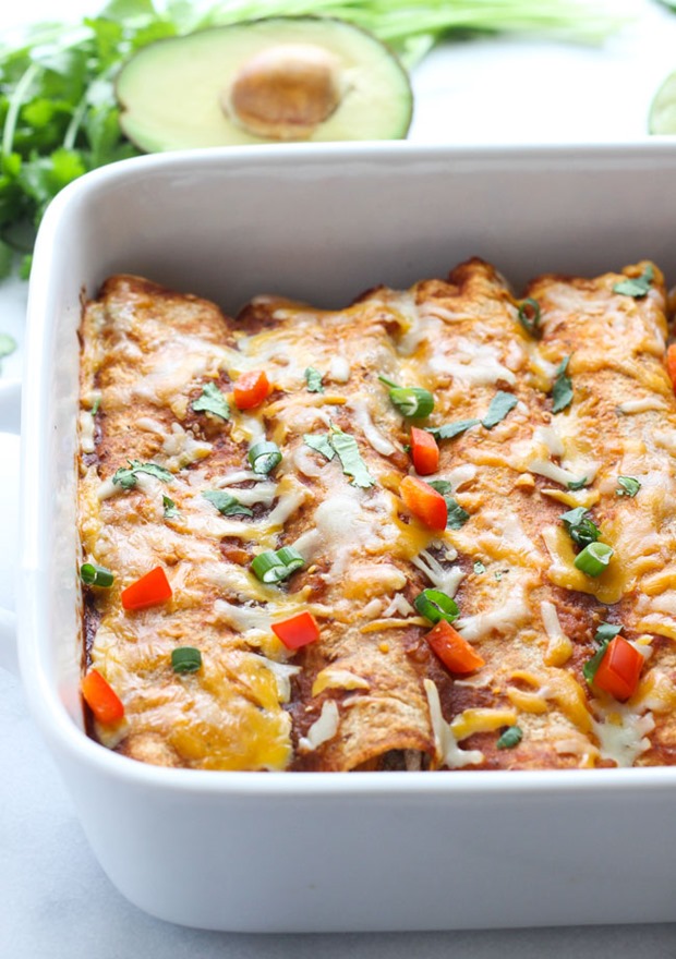 Sweet Potato Black Bean and Spinach Enchiladas- packed full of healthy veggies, these enchiladas are loaded with vitamins, mineral, protein and plenty of flavor! (vegetarian + gluten-free)