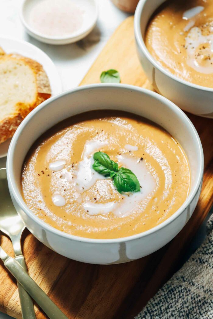 Creamy Roasted Eggplant Tomato Soup- caramelized eggplant and juicy ripe tomatoes come together for an irresistible and creamy soup that’s secretly vegan and gluten-free!