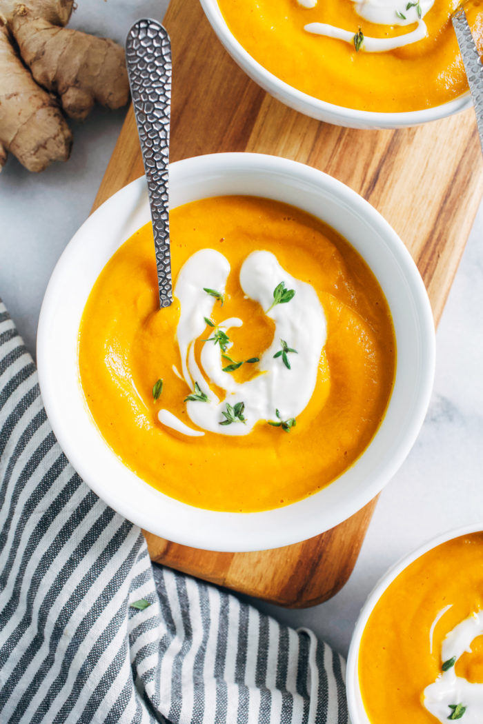 Carrot Ginger Soup with Maple Yogurt- cooked with fresh ginger and tangy apple cider vinegar, this healing soup is packed full of flavor and is super easy to make!