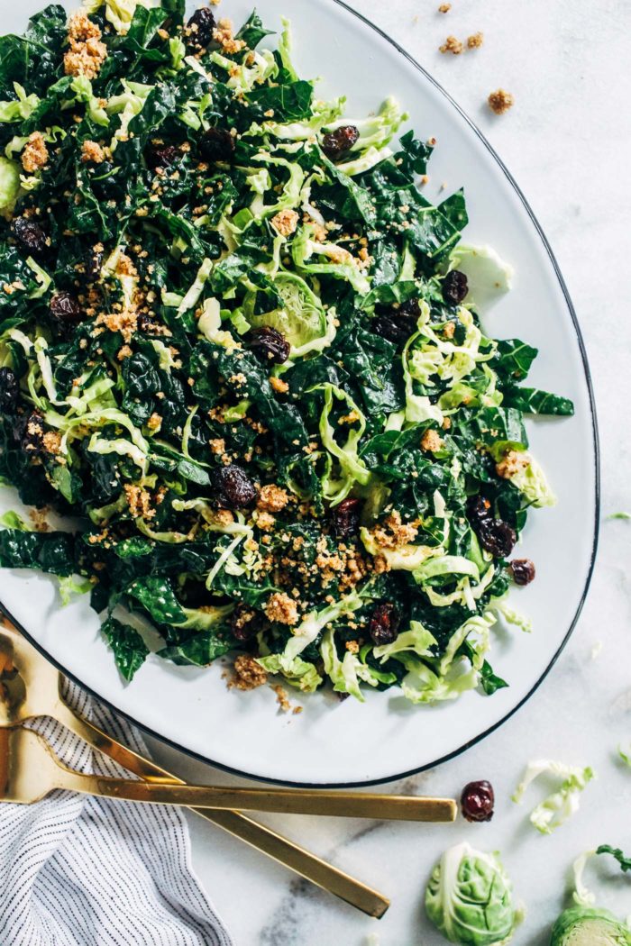 Shredded Brussels Sprout and Kale Salad with Maple Pecan Parmesan- this salad is robust and flavorful, making it perfect to prep ahead for the holidays or healthy lunches during the week! (vegan + gluten-free)