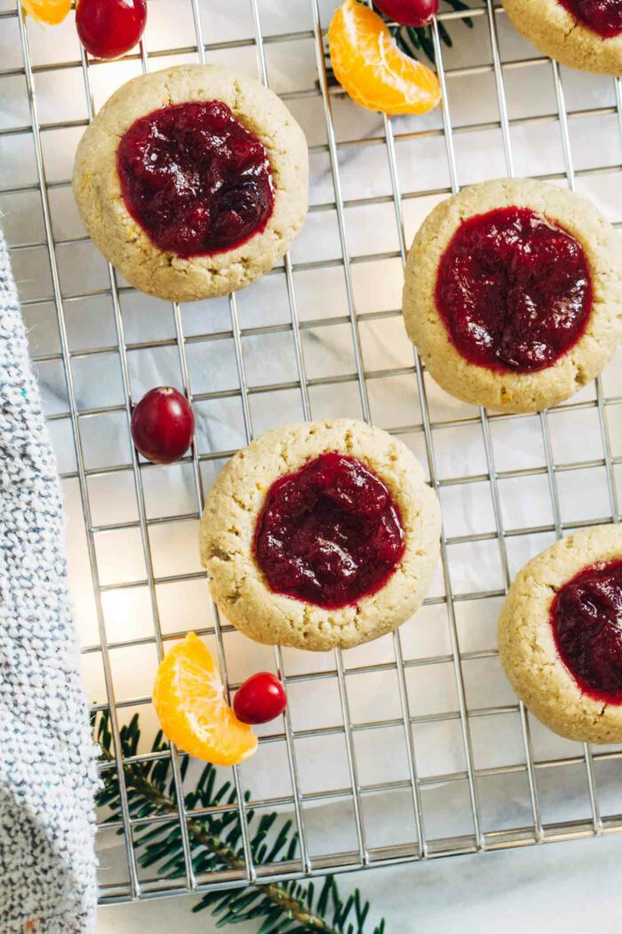 Cranberry Orange Thumbprint Cookies- made with orange zest and cranberry jam, these cookies make for a delicious and festive treat. No one will ever guess they are vegan and gluten-free!