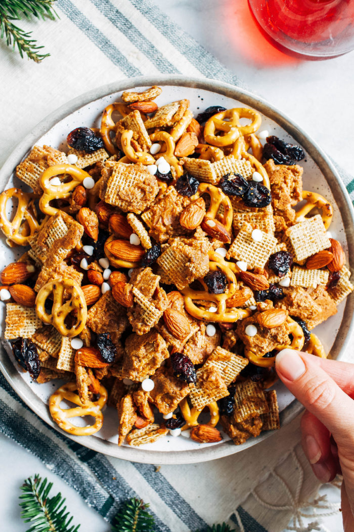 Honey Almond Holiday Snack Mix- coated with a simple blend of melted honey and almond butter, this snack mix is the perfect mix of salty, sweet and crunchy. It’s super addicting, easy to make and perfect for the holidays! (vegan + GF option)