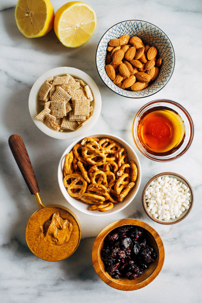 Honey Almond Holiday Snack Mix- coated with a simple blend of melted honey and almond butter, this snack mix is the perfect mix of salty, sweet and crunchy. It’s super addicting, easy to make and perfect for the holidays! (vegan + GF option)