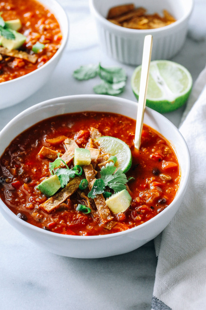 Slow Cooker Quinoa Tortilla Soup- a healthy meal that’s packed with plant protein and delicious southwestern flavor. Just throw everything into the Crockpot and dinner’s ready when you come home! (vegan + gluten-free)