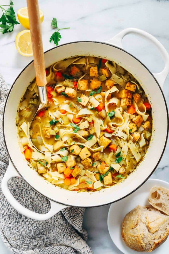 Tofu 'Chicken' Noodle Soup- packed with flavor and protein, you won't miss the chicken in this plant-based version of the classic chicken noodle soup. (vegan with gluten-free option)