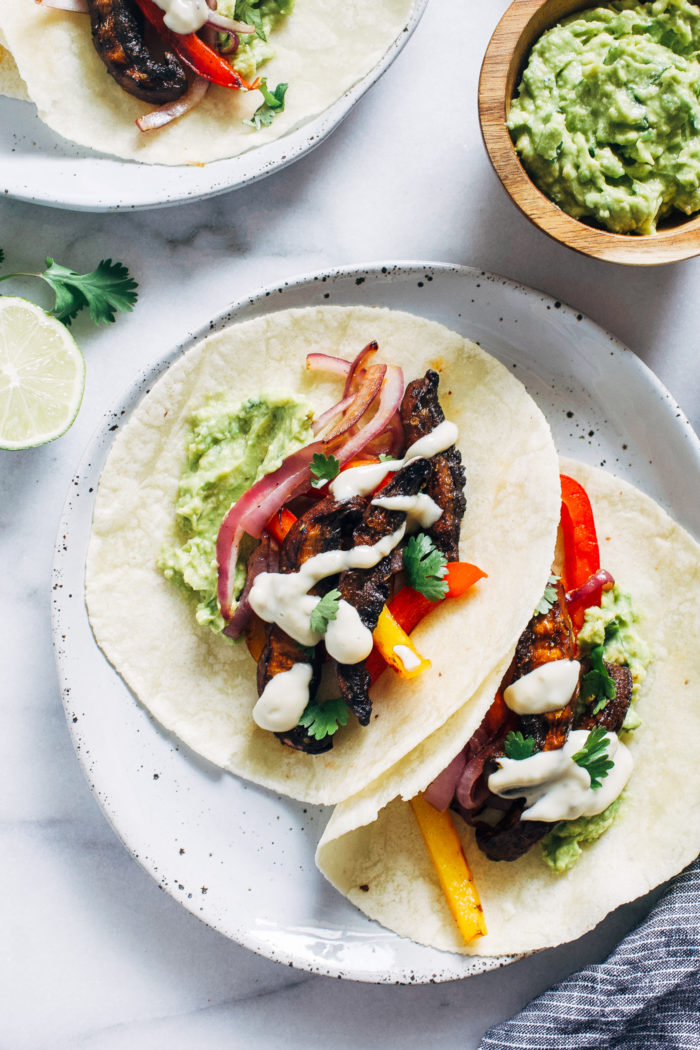 Grilled Portabello Mushroom Fajitas- marinated portabello mushrooms give these plant-based fajitas delicious meaty texture. Easy to make and ready in just 30 minutes! 