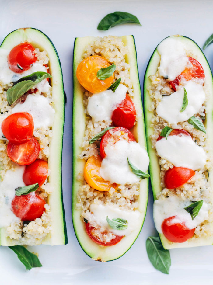 Margherita Zucchini Boats- a light and healthy take on the delicious Margherita Pizza. One serving has just 260 calories + 16 grams of protein! (gluten-free + vegetarian with vegan option)