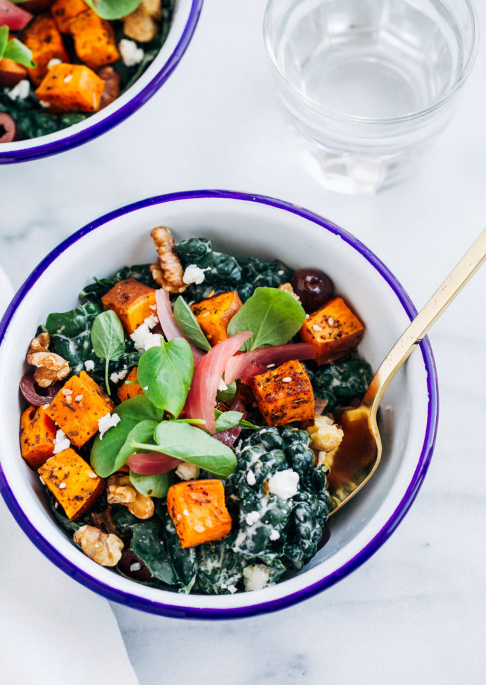 Sweet Potato Souvlaki Bowls- kale tossed with garlic, lemon and yogurt dressing topped with za'atar roasted sweet potatoes. So flavorful and healthy too! (vegetarian and gluten-free with vegan option)