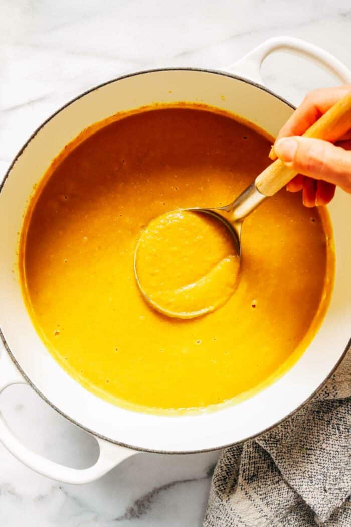 Curried Red Lentil Pumpkin Soup- made with roasted pumpkin and warming spices, each bowl packs 14 grams of protein! (vegan + gluten-free)