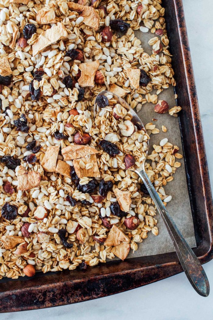 Apple Cinnamon Granola with Hazelnuts and Cranberries- a hearty granola that's bursting with flavor and texture. Gluten-free, vegan and refined sugar-free!