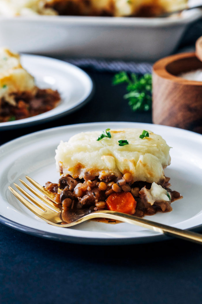 Vegan Lentil Shepherds Pie- a plant-based take on the comforting classic made with lentils, mushrooms and red wine. Topped with parsnip mashed potatoes for even more flavor! (gluten-free)
