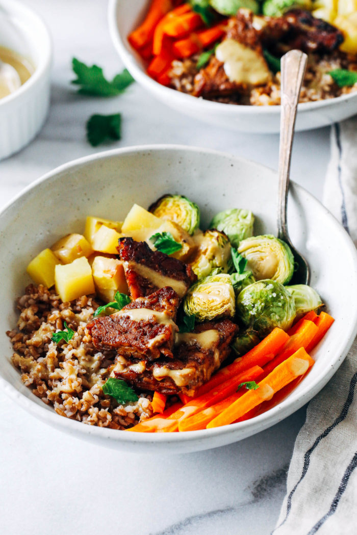 Balsamic Dijon Tempeh Buddha Bowls- tempeh marinated in a maple balsamic dijon laze, roasted with hearty vegetables and topped with a simple dijon sauce. A healthy meal that's super easy to make and packed with flavor! (vegan + gluten-free)
