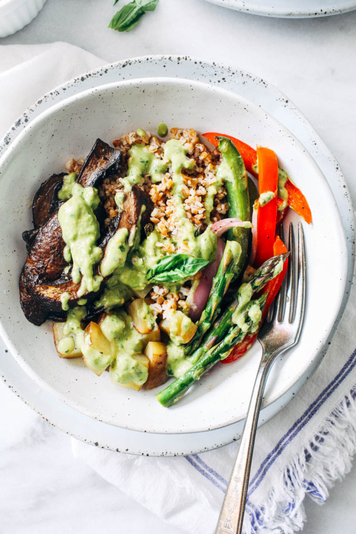 Roasted Mushroom Vegetable Bowls with Avocado Pistachio Pesto- portobello mushrooms and spring vegetables are roasted in one-pan and topped with a creamy avocado pistachio pesto. Super easy, flavorful and satisfying! (vegan with gluten-free option)