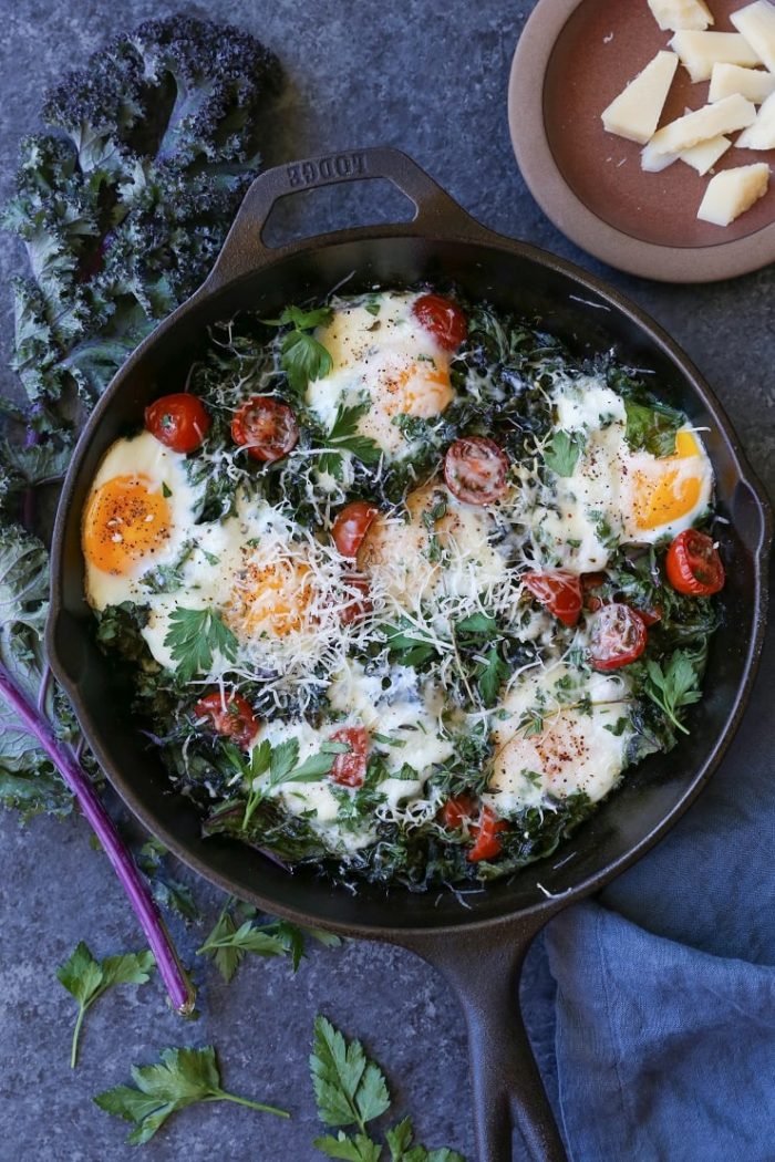 Tomato, Kale and Parmesan Baked Eggs from The Roasted Root