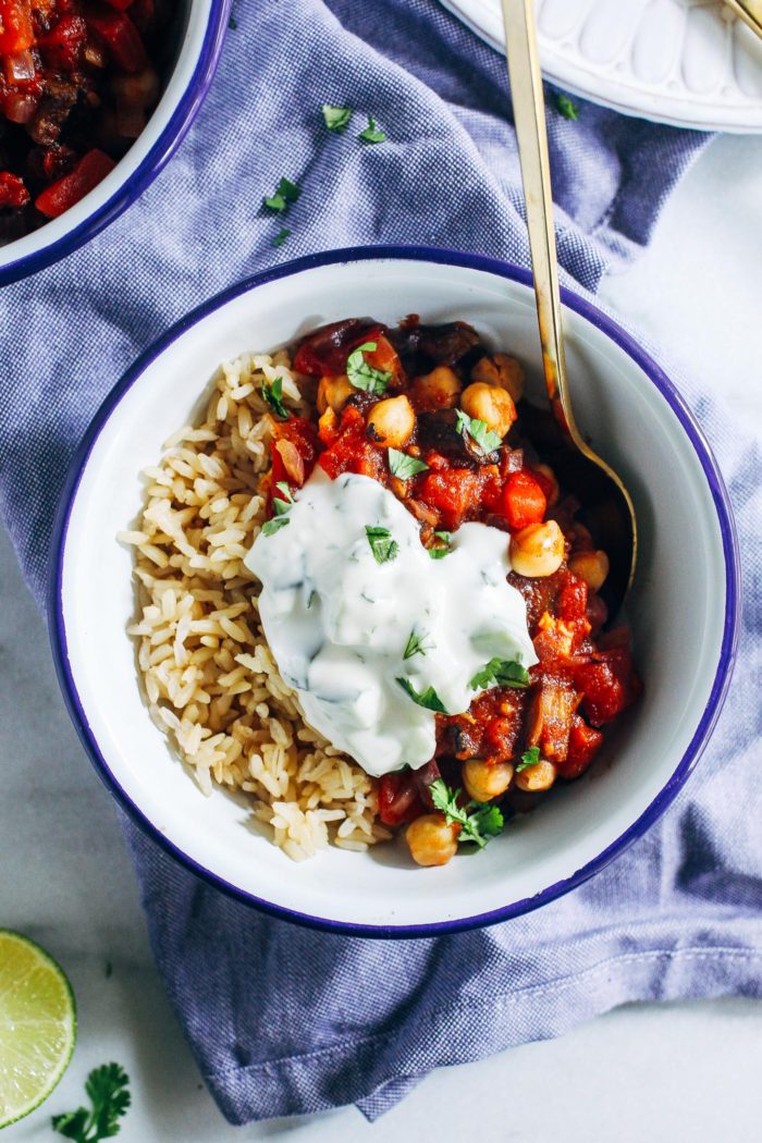Eggplant Curry with Cucumber Mint Raita- roasted eggplant tossed with tomatoes and spices and served with a minty cucumber lime yogurt sauce. (vegan + gluten-free)