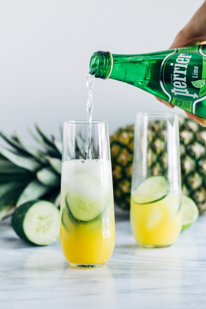 Pineapple Cucumber Lime Spritzers- pineapple juice served with cucumber, lime, and mint infused sparkling water makes for a light and refreshing drink that's perfect for summer!