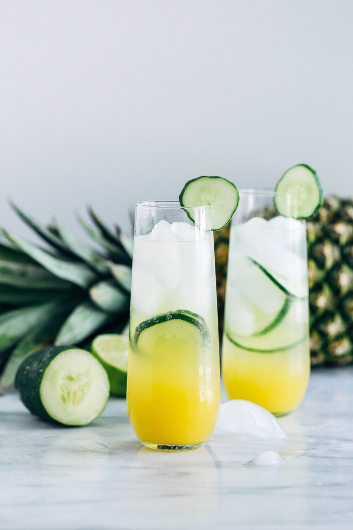 Pineapple Cucumber Lime Spritzers- pineapple juice served with cucumber lime infused sparkling water makes for a light and refreshing drink that's perfect for summer!