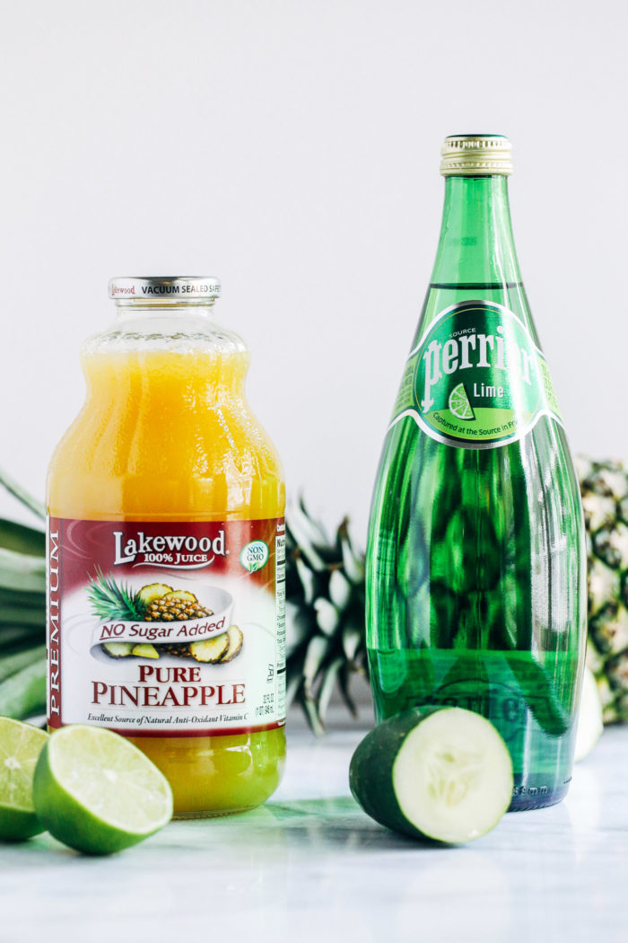 Pineapple Cucumber Lime Spritzers- pineapple juice served with cucumber lime infused sparkling water makes for a light and refreshing drink that's perfect for summer!