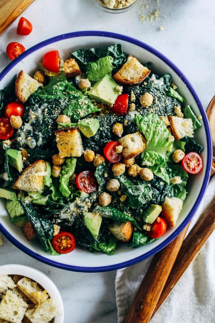 The Best Vegan Kale Caesar- a healthier caesar salad made with superfood kale and a creamy tahini-based dressing. Topped with crispy chickpeas and homemade sourdough croutons, this salad is sure to blow everyone away! 