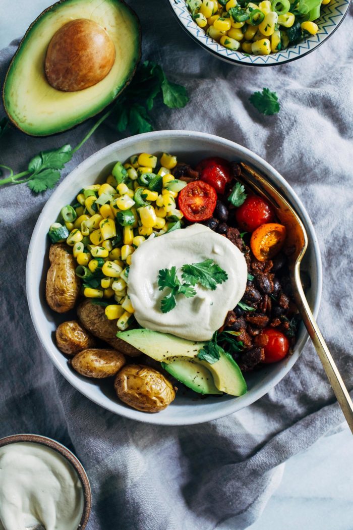 Roasted Potato Burrito Bowls- crispy roasted potatoes stand-in for rice in this satisfying Mexican-inspired dish. Each bowl has 21 grams of protein and 25% of the RDV of iron! (vegan, gluten-free + grain-free)