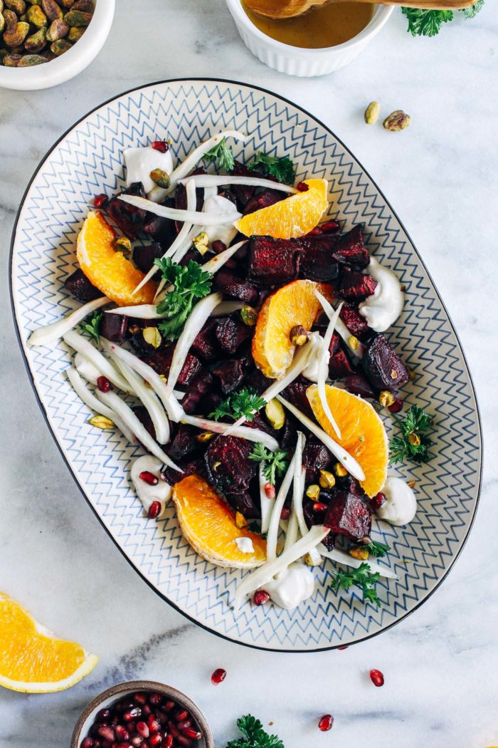 Citrus Glazed Beet Salad with Cashew Cream- fresh beets roasted in a simple citrus glaze and served with fresh fennel, orange segments, crushed pistachios and a silky cashew cream. Perfect for entertaining or to serve as a healthy side item. (vegan, gluten-free + grain-free)