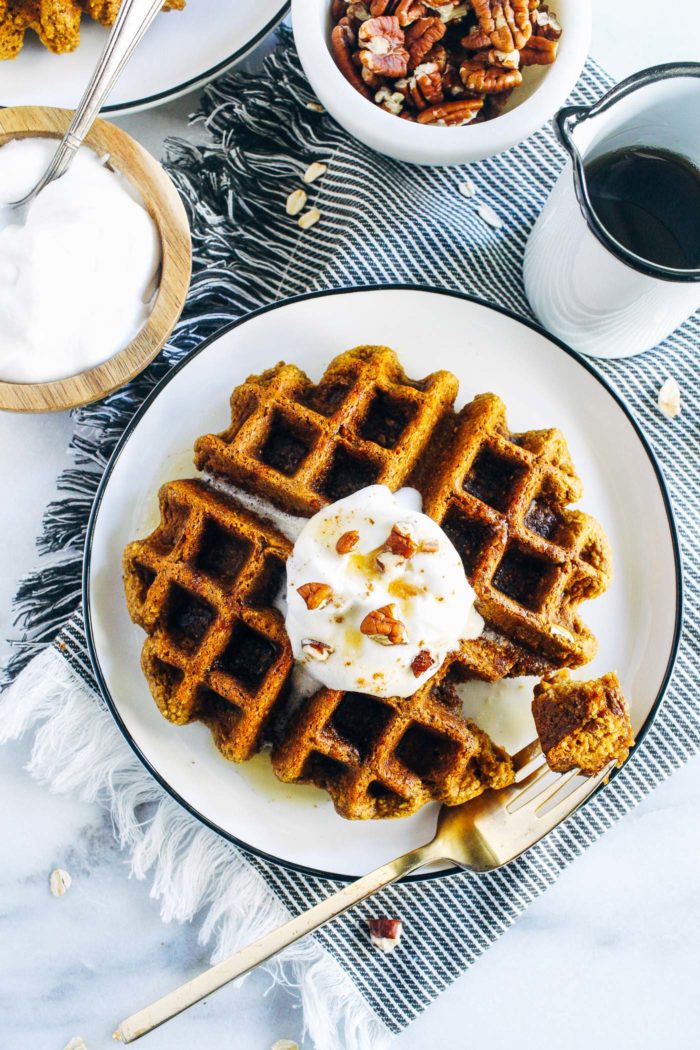 Flourless Vegan Pumpkin Oatmeal Waffles- made with rolled oats and pumpkin puree, these waffles are hearty, satisfying and perfect for fall. Don't have a waffle maker? The recipe makes delicious pancakes too! (vegan, gluten-free + oil-free)