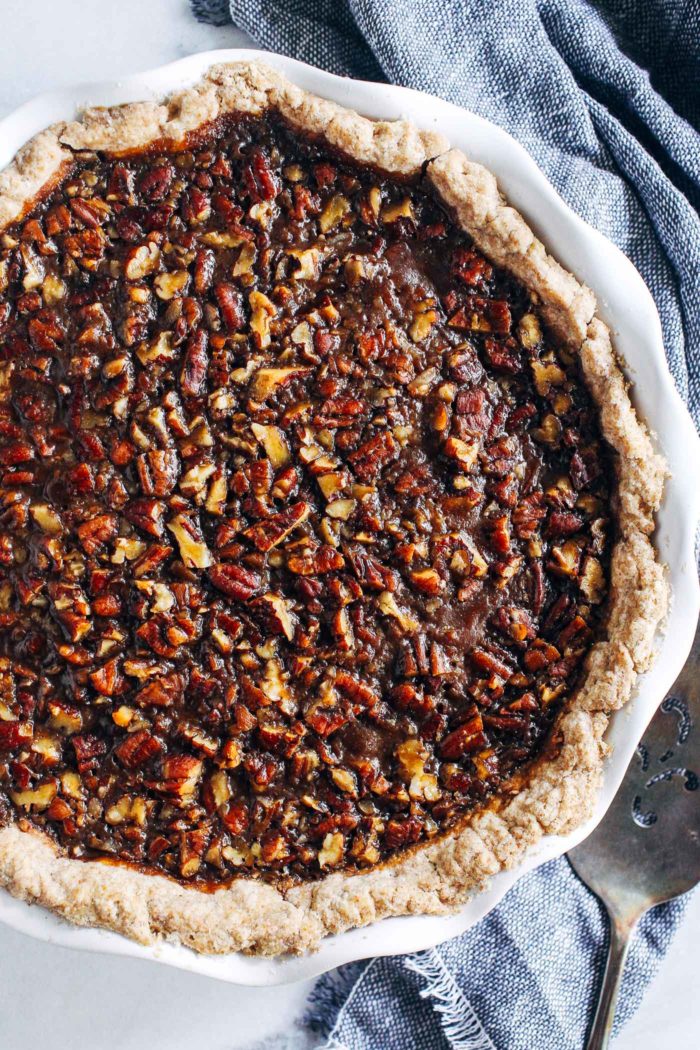 Vegan Sweet Potato Pecan Pie- layered with sweet potato filling on the bottom and a pecan pie top. You won't believe how easy it is to make! (vegan, refined sugar-free, + a gluten-free option)