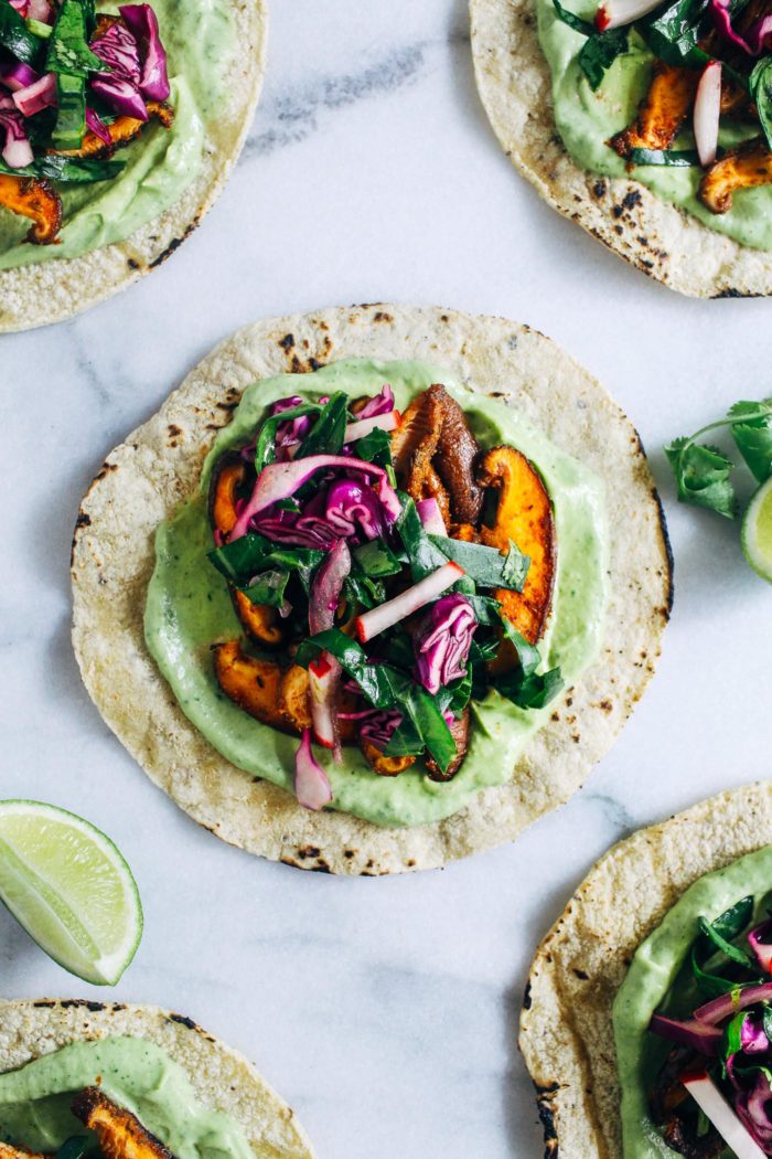 Blackened Mushroom Tacos with Collard Green Slaw- packed full of superfood antioxidant power, these tacos are made with sautéed mushrooms, avocado cream and a tangy collard green slaw. Eating your greens has never tasted better! (vegan, gluten-free, soy-free)