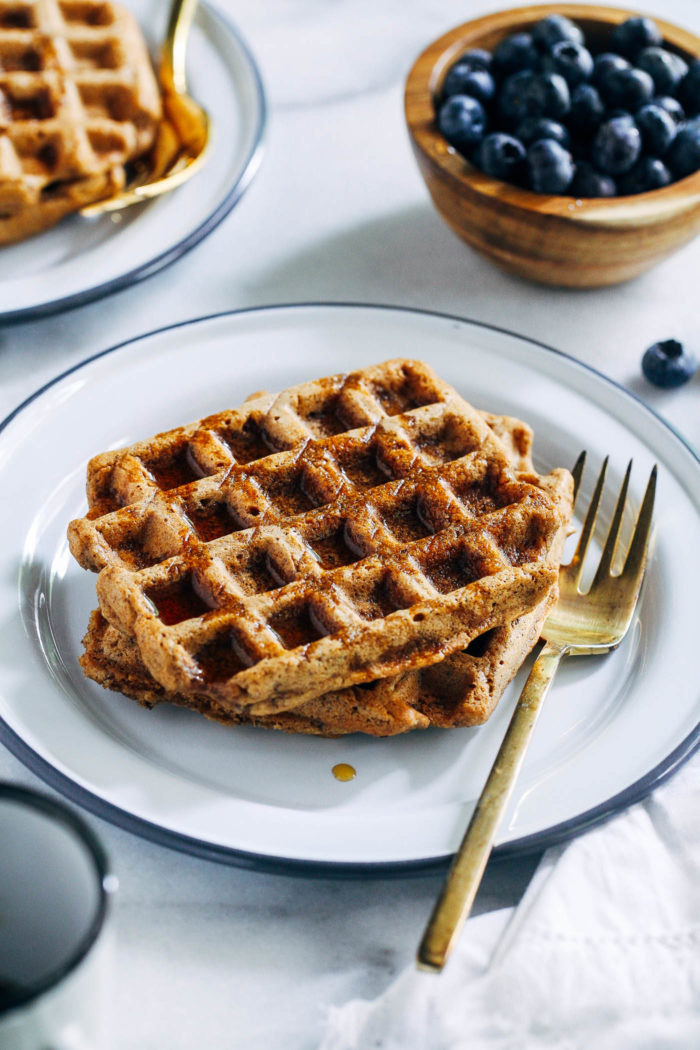 Vegan Gluten-free Oat Flour Waffles- all you need is 10 ingredients to make these crispy vegan waffles. You would never guess they are naturally gluten-free and oil-free too! #vegan #plantbased