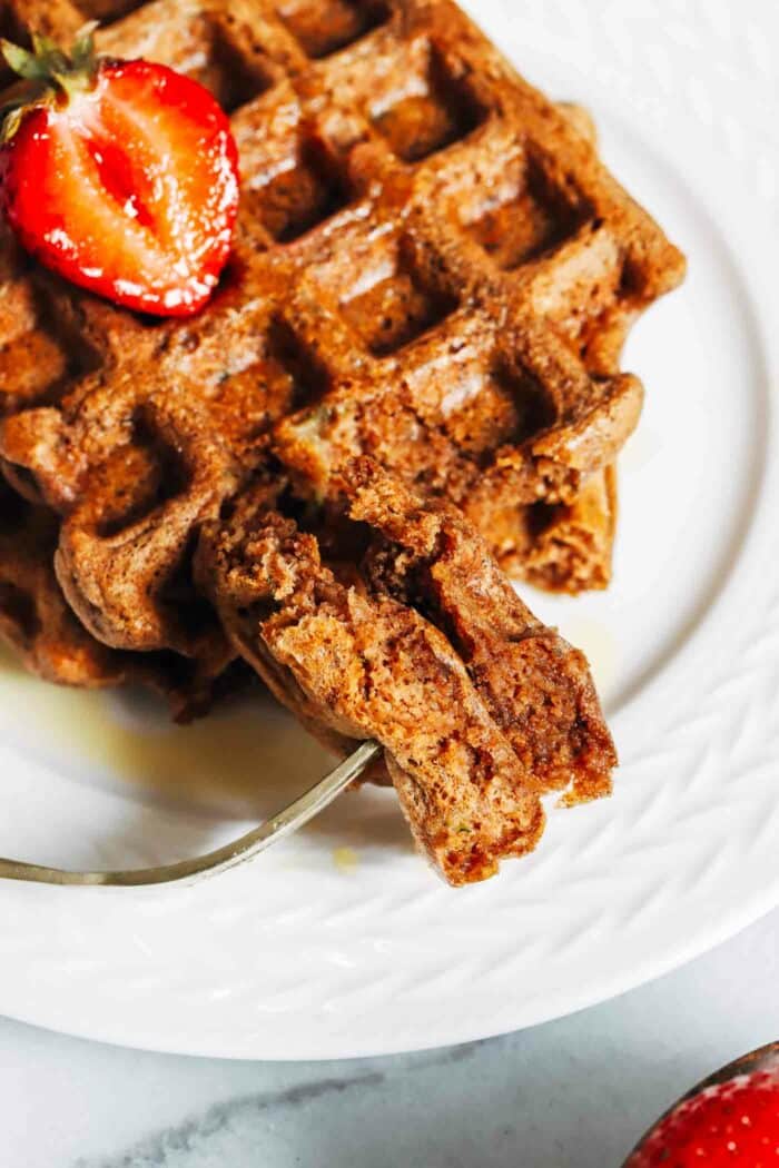 Zucchini Oatmeal Protein Waffles- Made with whole grain oats and grated zucchini, each light and crispy waffle packs 10g of protein! (dairy-free, gluten-free and oil-free)