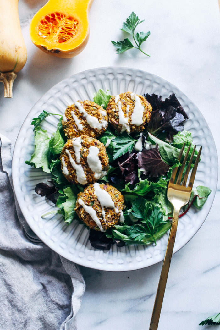 Butternut Squash Falafel with Maple Tahini Sauce- a fall inspired falafel that's baked instead of fried. Perfect for prepping ahead for healthy lunches or dinner! #vegan #glutenfree #plantbased #healthymeals #fallrecipes