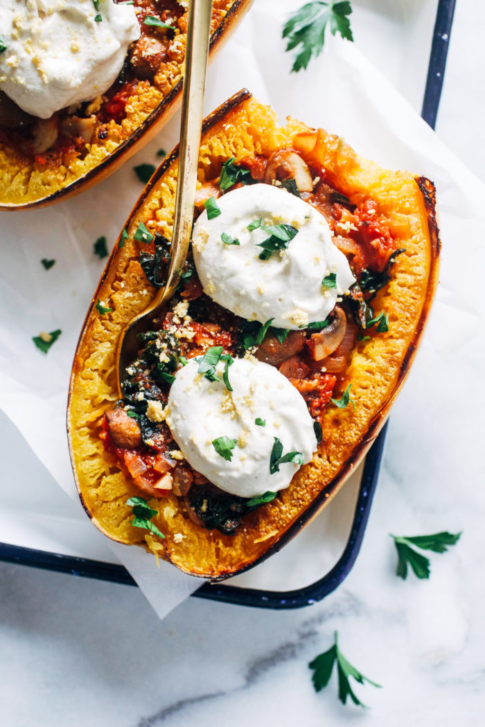 Vegan Spaghetti Squash Lasagna Bowls- layered with a hearty vegetable filling and topped with creamy cashew ricotta, these lasagna bowls make for a flavorful and filling plant-based meal!