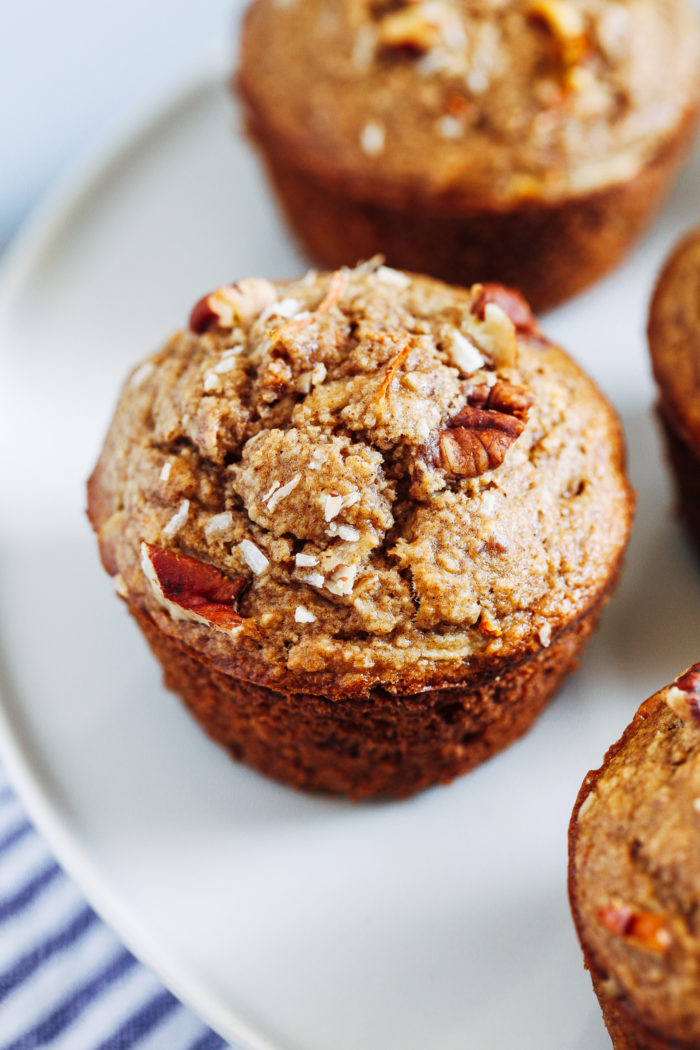 Healthy Flourless Morning Glory Muffins- packed full of healthy ingredients, these muffins make a perfect on-the-go breakfast or snack. They also happen to be gluten-free, oil-free, dairy-free, and refined sugar-free!