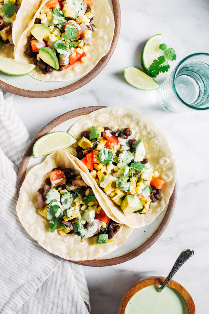 Grilled Summer Vegetable Tacos- summer's best veggies grilled and served with seasons black beans. Topped with a creamy cilantro sauce and just 30 minutes to make! (vegan + GF option)