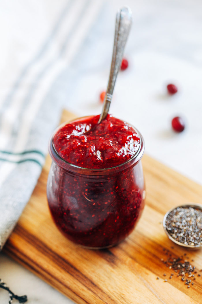 Cranberry Chia Jam- this simple cranberry jam is bursting with antioxidants and healthy fats. Perfect for topping toast, oatmeal, waffles or pancakes!