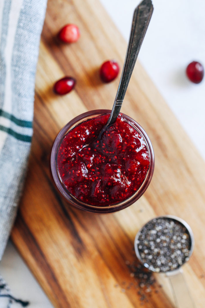 Cranberry Chia Jam- this simple cranberry jam is bursting with antioxidants and healthy fats. Perfect for topping toast, oatmeal, waffles or pancakes!