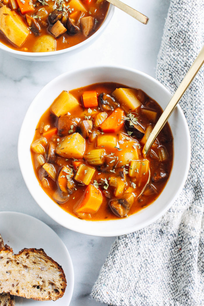 Vegan Mushroom Stew- made with hearty mushrooms and potatoes cooked in a savory broth, this meatless version of beef stew is sure to hit the spot on a cold winter day! 