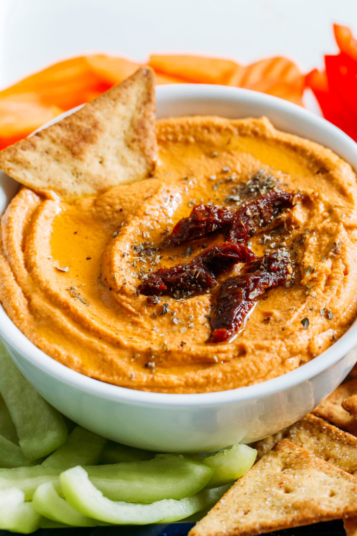 Sundried Tomato Hummus- all you need is 6 ingredients and 10 minutes to make this creamy, umami filled hummus that can be used for a variety of dishes or enjoyed all on it's own! 