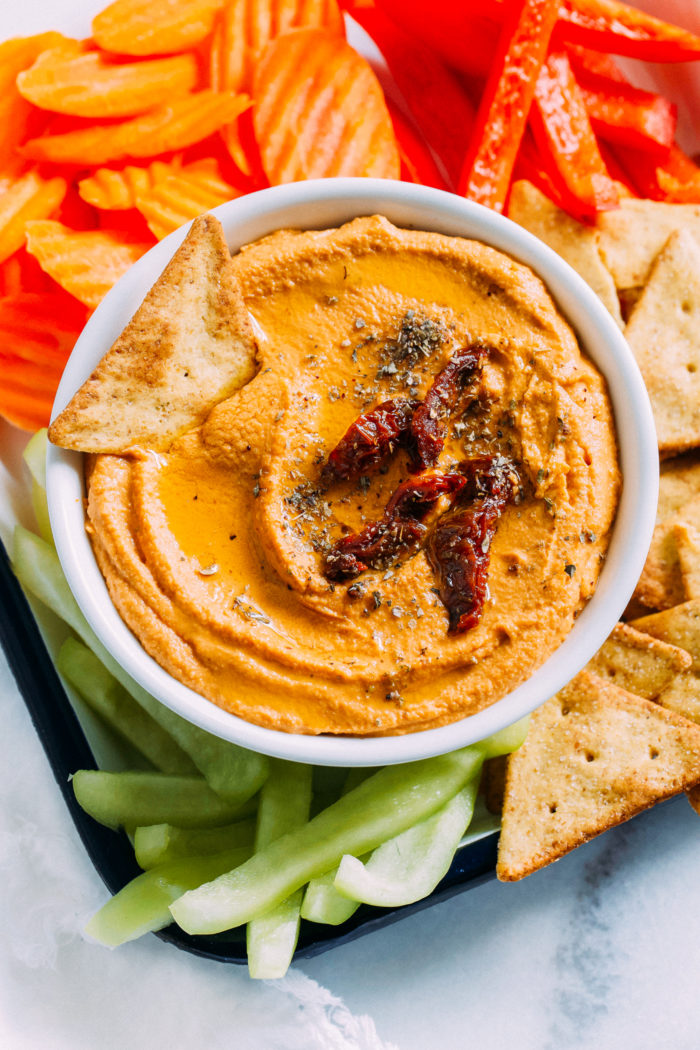 Sundried Tomato Hummus- all you need is 6 ingredients and 10 minutes to make this creamy, umami filled hummus that can be used for a variety of dishes or enjoyed all on it's own! 