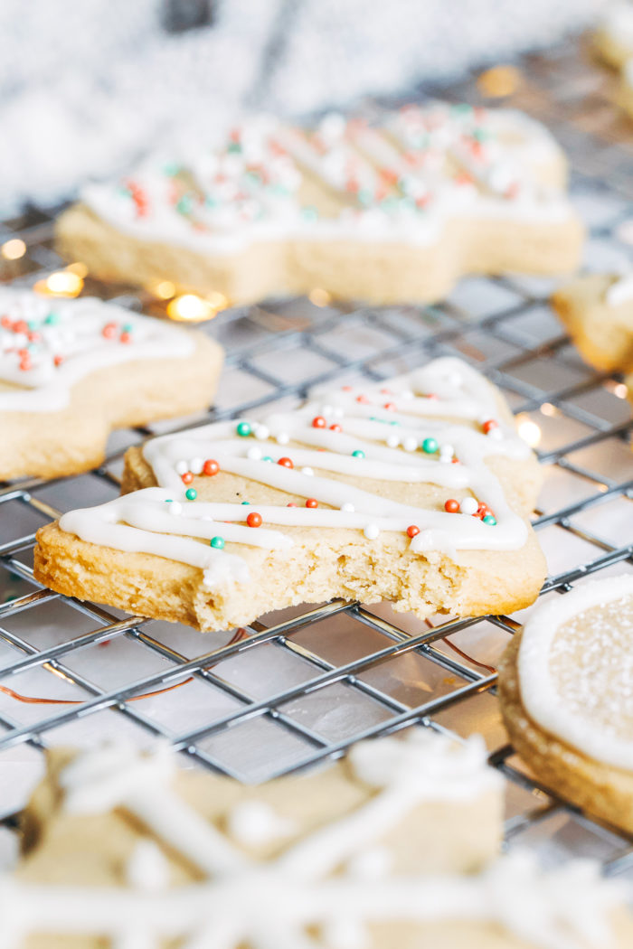 Vegan and Gluten-free Sugar Cookies- made with buttery almond flour, these cookies have crisp edges and a delicious chewy center. They're super simple to make and no one would ever guess they are made with healthier ingredients!